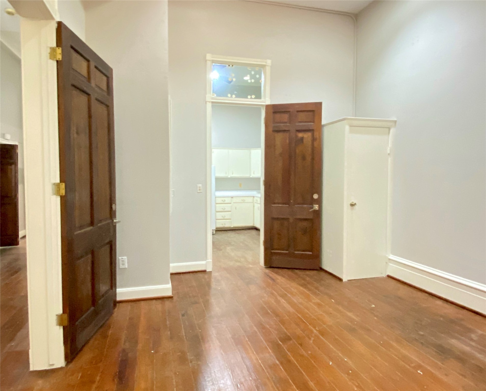 2319 The Strand, Unit 2A Galveston, TX 77550 - Photo 25 of 32 an empty room with wooden floor and closet