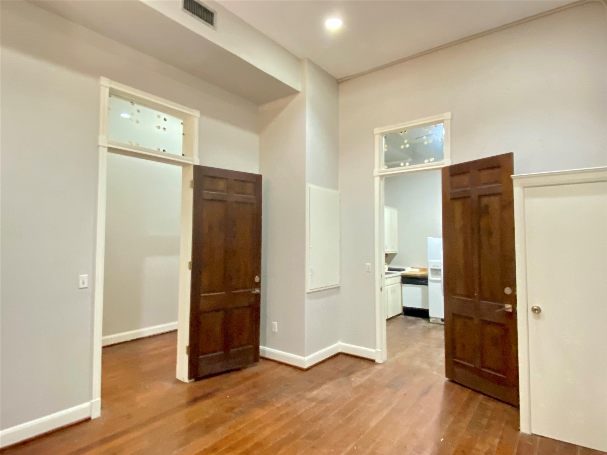 2319 The Strand, Unit 2A Galveston, TX 77550 - Photo 26 of 32 an empty room with wooden floor and closet