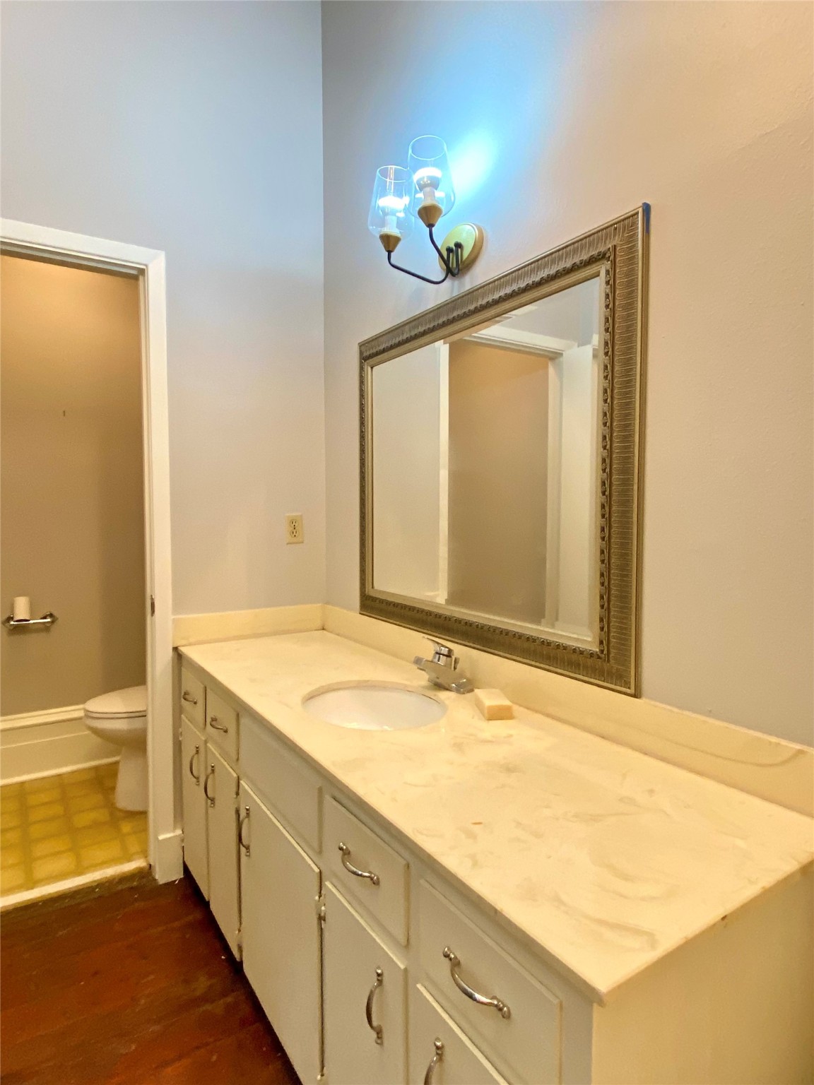 2319 The Strand, Unit 2A Galveston, TX 77550 - Photo 28 of 32 a bathroom with a sink and a mirror
