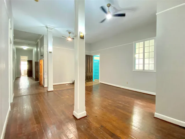a view of livingroom with furniture wooden floor and windows