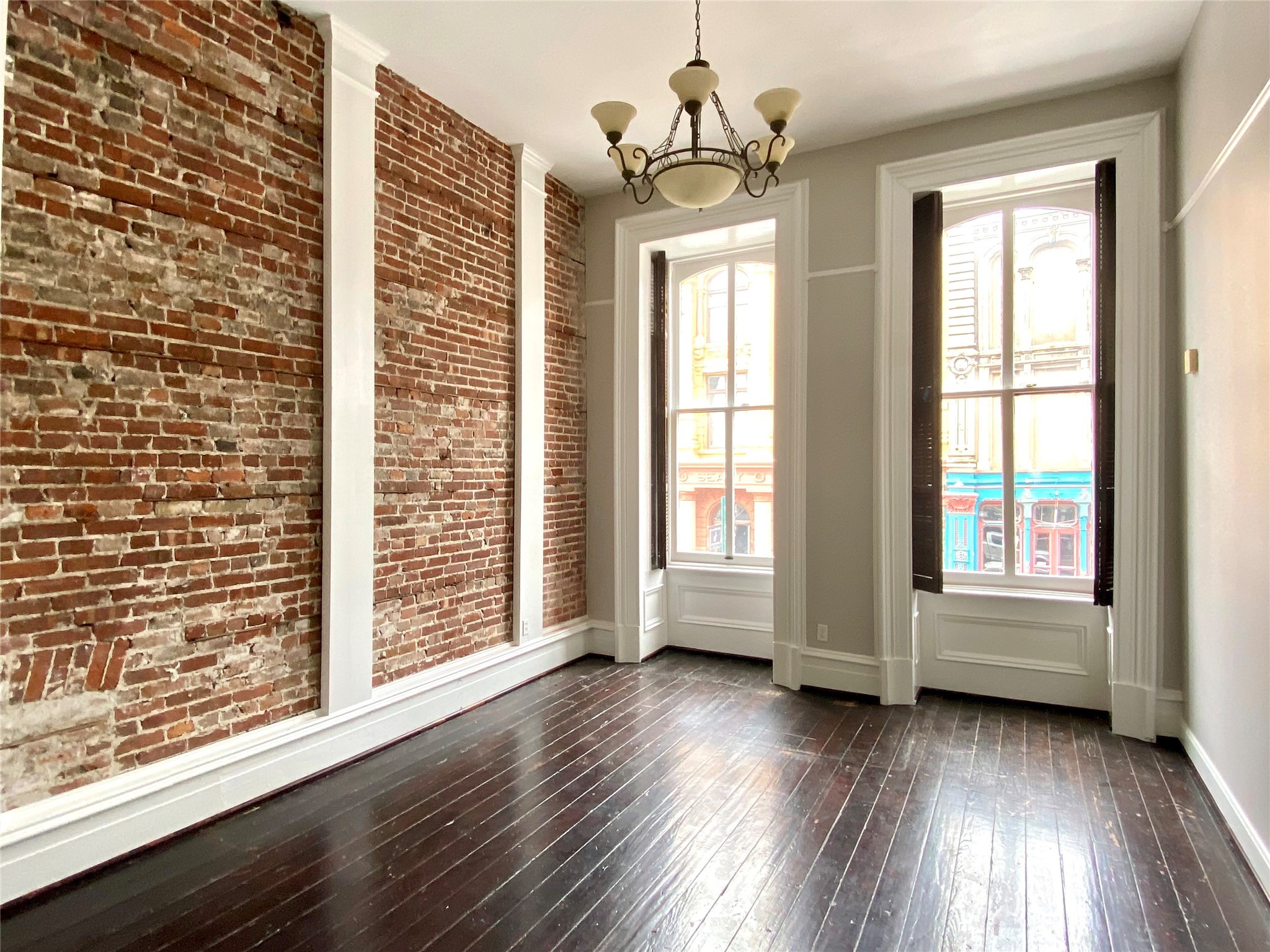 2319 The Strand, Unit 2A Galveston, TX 77550 - Photo 6 of 32 a view of livingroom with furniture wooden floor and windows