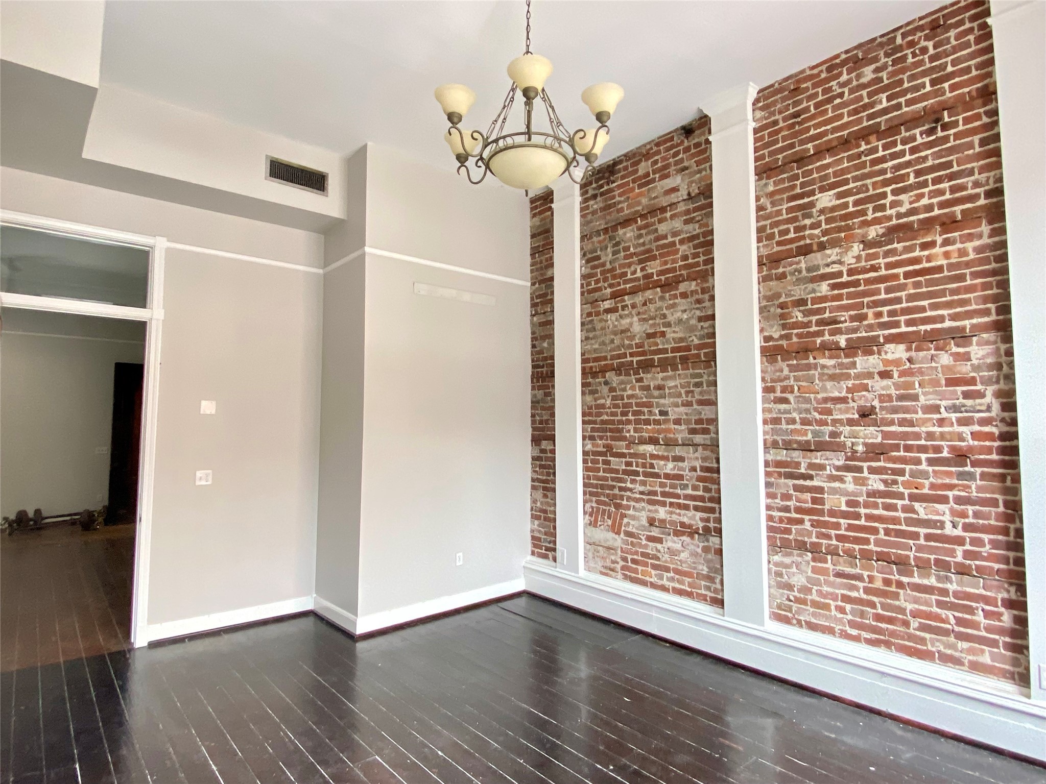 2319 The Strand, Unit 2A Galveston, TX 77550 - Photo 9 of 32 a view of entryway with wooden floor