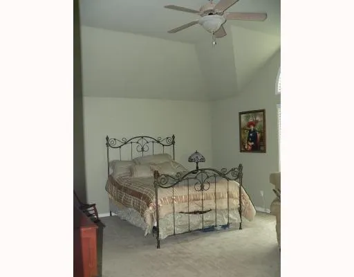 a bedroom with a bed and a cabinets