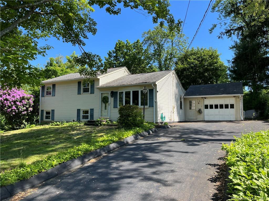 58 Dee Avenue Meriden, CT 06451 - Photo 1 of 1 a front view of a house with a garden