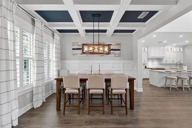 a kitchen with a table and chairs in it