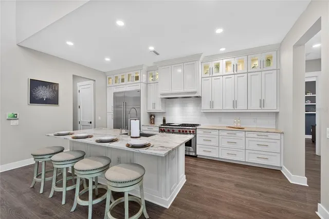 a spacious bedroom with a bed and a large window