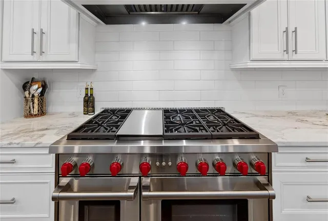a spacious bedroom with a bed and a desk