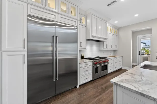 a bathroom with a shower a toilet and a sink