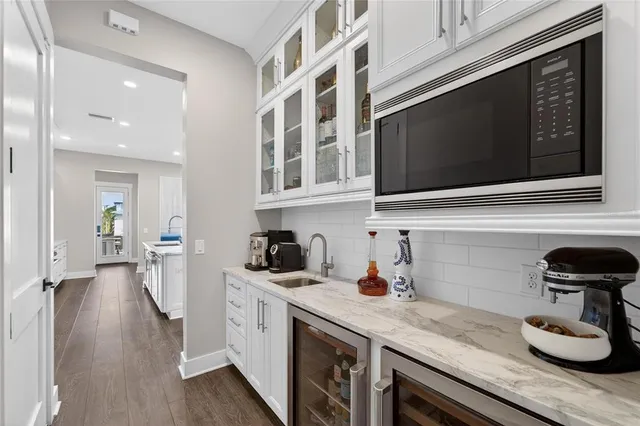 a view of walk in closet with clothes