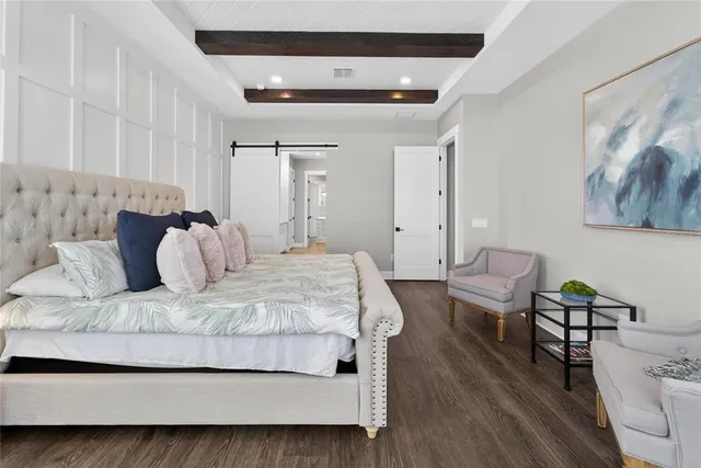 a bedroom with a bed and a dresser