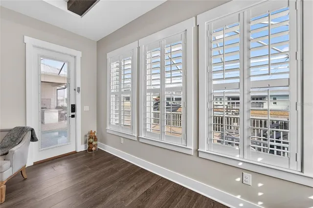 a bathroom with a sink a toilet a mirror and shower