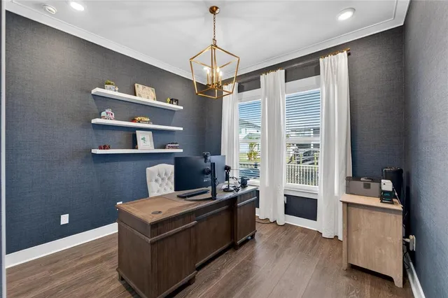 a bedroom with a bed and a ceiling fan