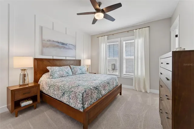 a bedroom with a bed and a lamp