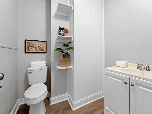 a bathroom with a toilet and a sink