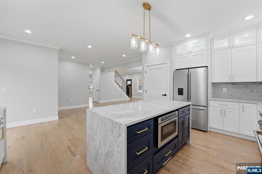 20 Barnsdale Road Wayne, NJ 07470 - Photo 14 of 40 a kitchen with stainless steel appliances granite countertop a sink a refrigerator and a stove