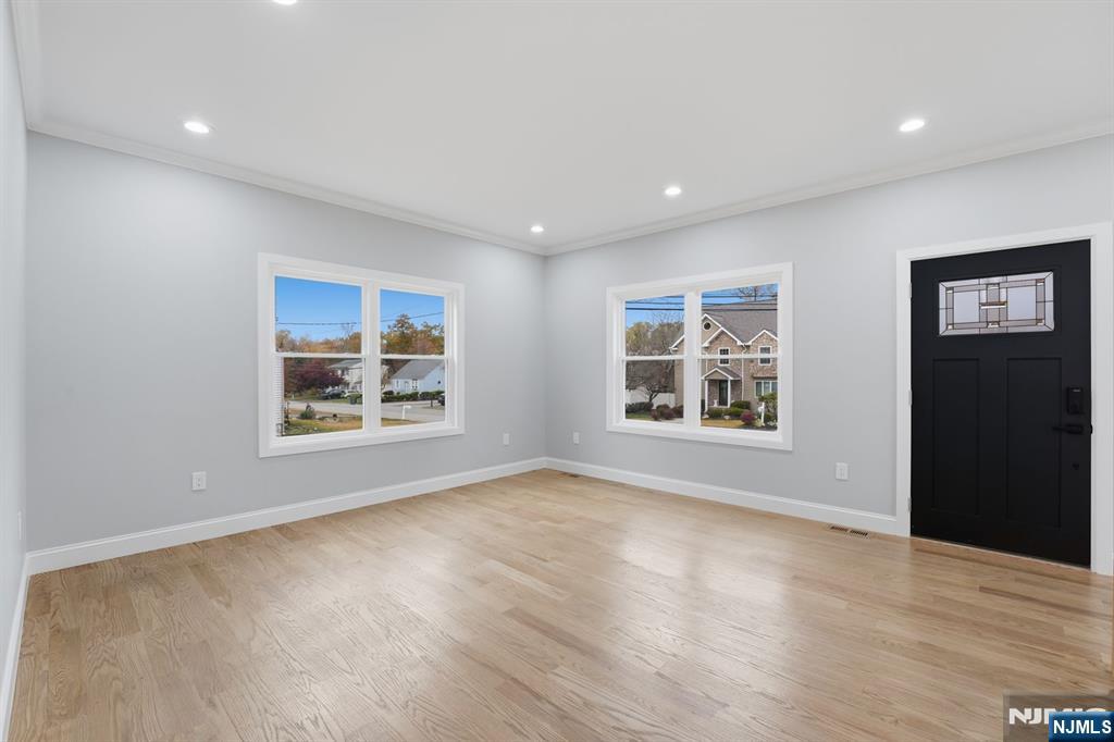 20 Barnsdale Road Wayne, NJ 07470 - Photo 17 of 40 a view of an empty room with a window and wooden floor