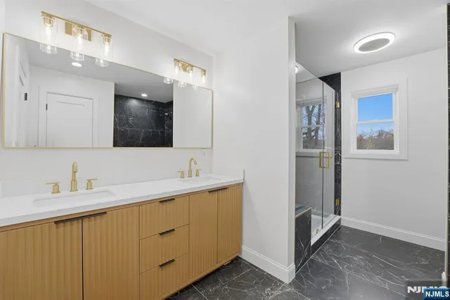 a view of a balcony with wooden floor and fence