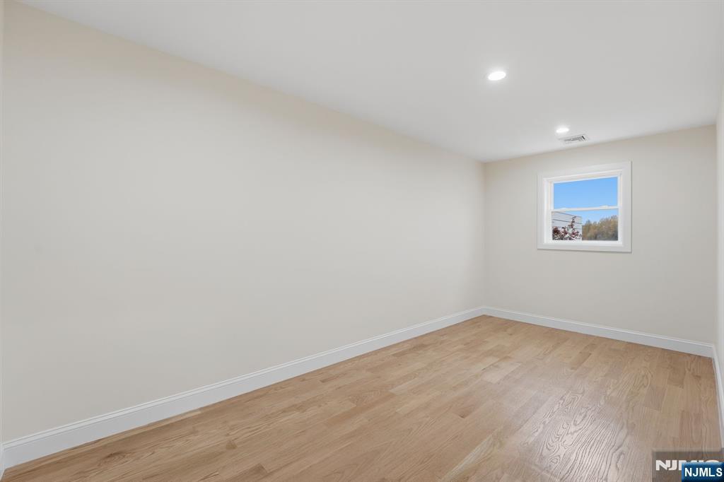 20 Barnsdale Road Wayne, NJ 07470 - Photo 25 of 40 a view of empty room with wooden floor