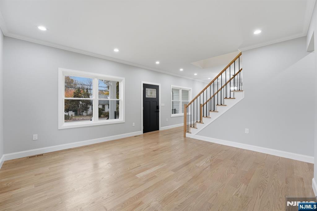 20 Barnsdale Road Wayne, NJ 07470 - Photo 5 of 40 a view of an empty room with wooden floor and a window