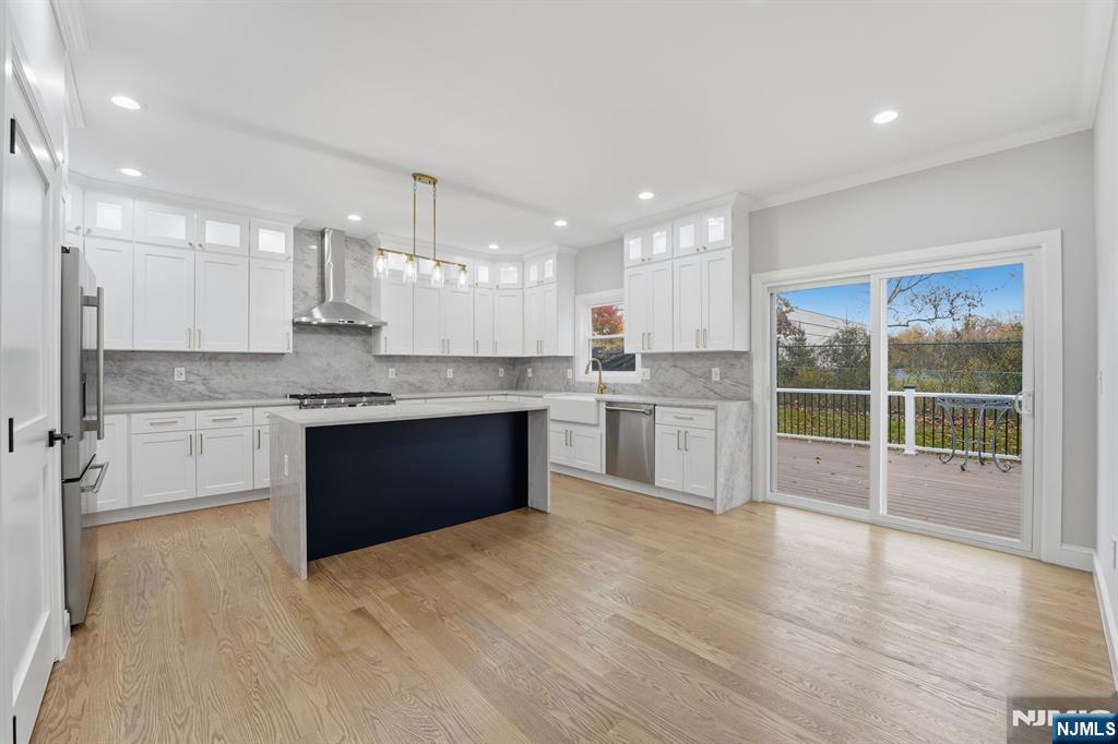 20 Barnsdale Road Wayne, NJ 07470 - Photo 9 of 40 a large kitchen with kitchen island a large counter top and appliances