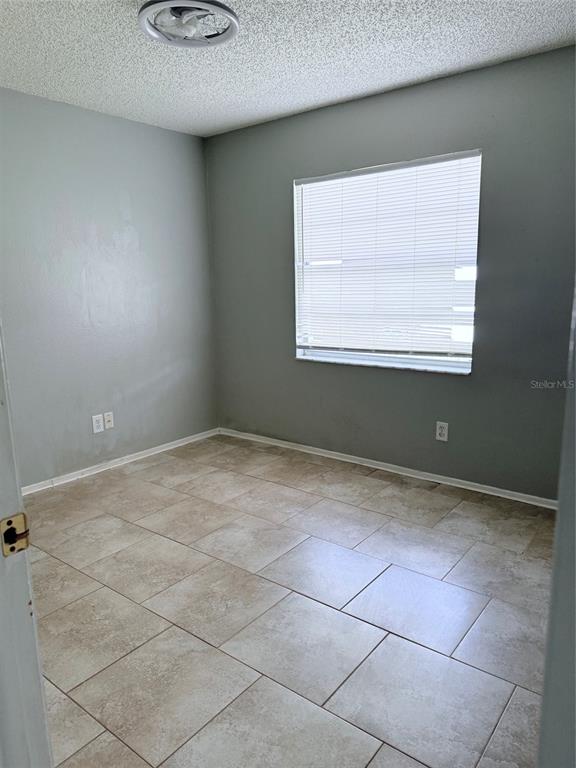 1636 Baker Road Lutz, FL 33559 - Photo 10 of 13 an empty room with a workbench