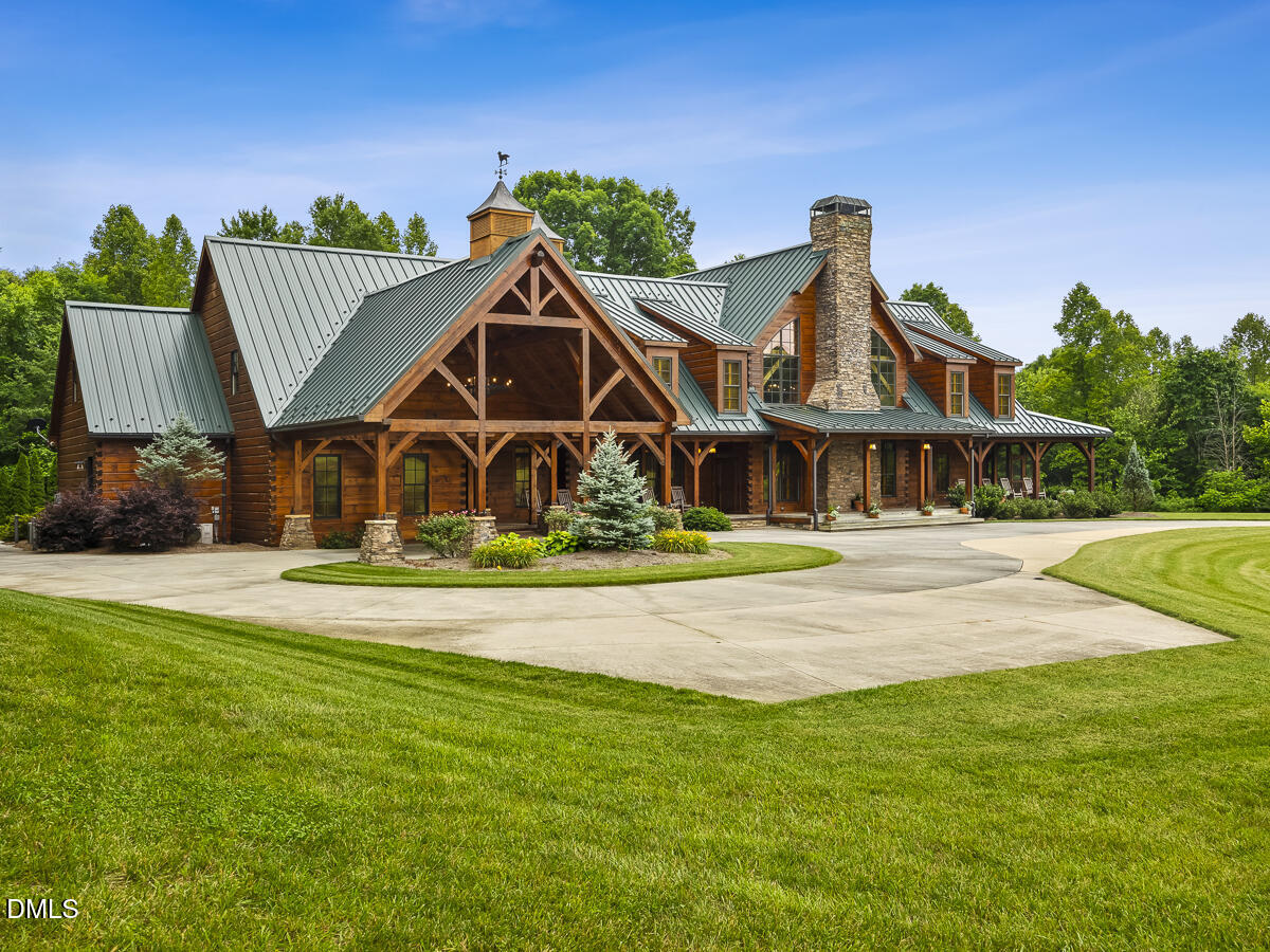 390 Line Creek Farm Road Yanceyville, NC 27379 - Photo 9 of 102 a front view of a house with garden