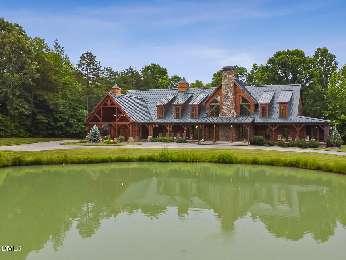 390 Line Creek Farm Road Yanceyville, NC 27379 - Photo 17 of 102 a aerial view of a house with a swimming pool