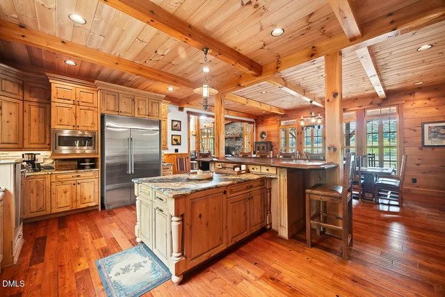 a view of living room with furniture and wooden floor