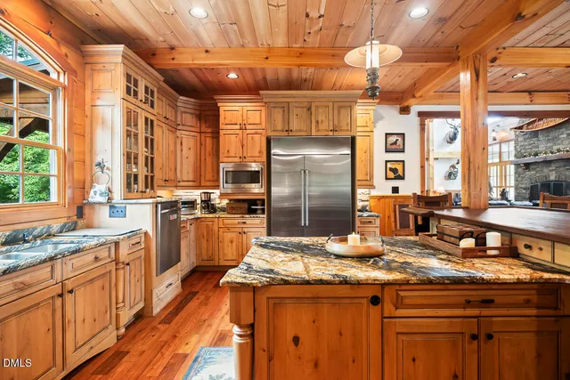 a view of living room kitchen and entryway