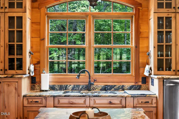 a view of a chairs and table in a patio