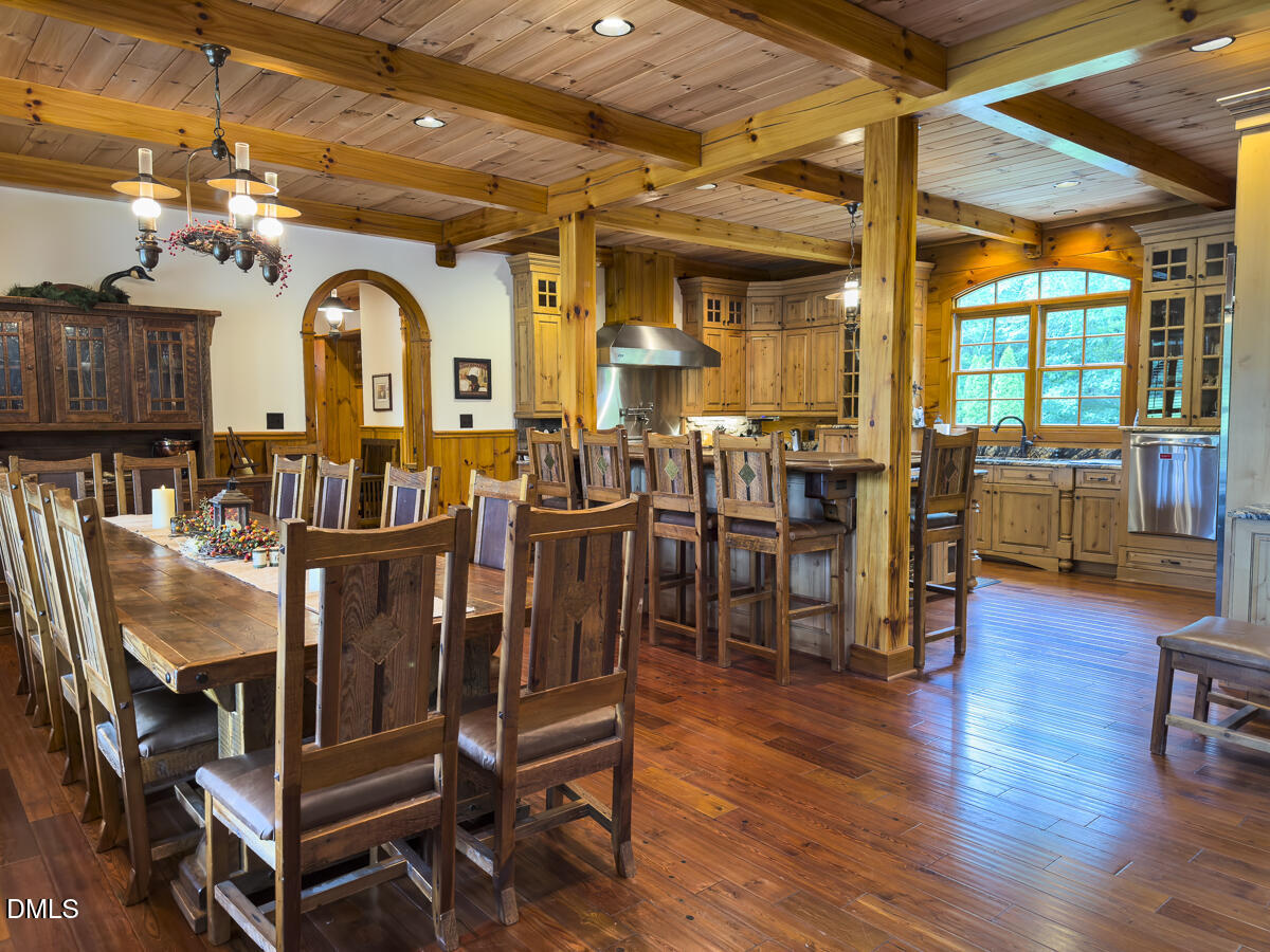 390 Line Creek Farm Road Yanceyville, NC 27379 - Photo 28 of 102 a view of a dining room with furniture window and wooden floor