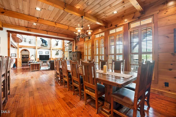 a bed room with a bed a couch and a window