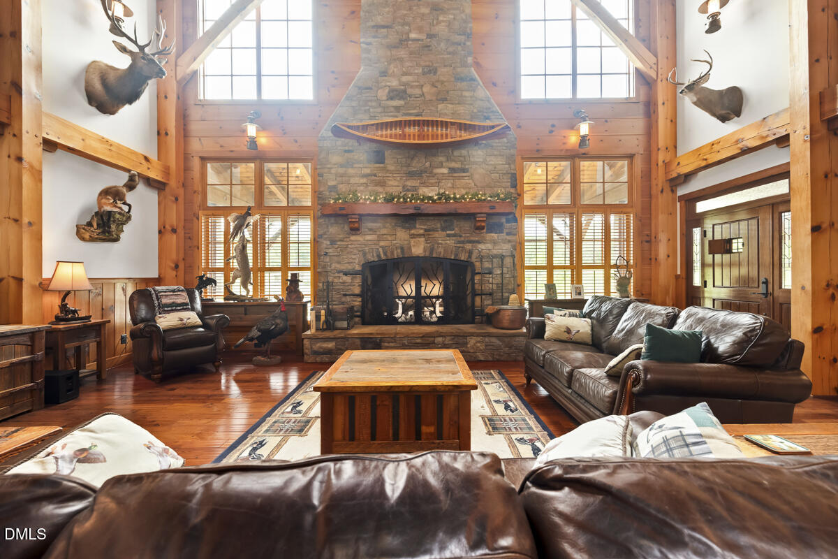 390 Line Creek Farm Road Yanceyville, NC 27379 - Photo 33 of 102 a living room with furniture fireplace and a large window