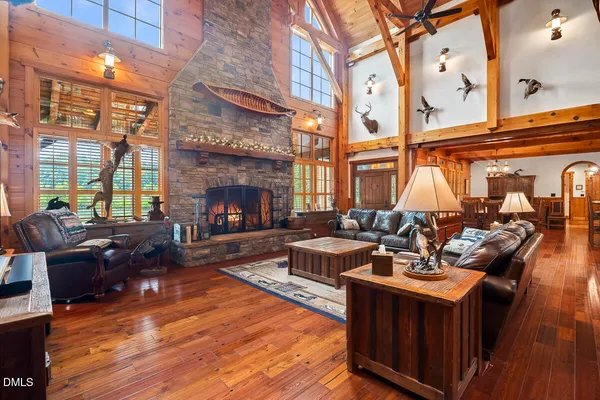 a view of a house with a yard and a pond