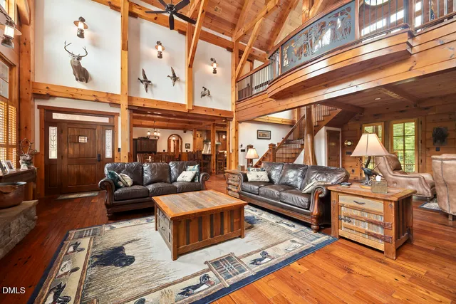 a view of a backyard with potted plants and large trees