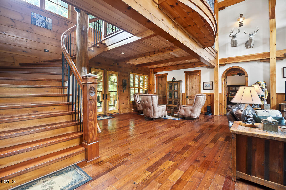 390 Line Creek Farm Road Yanceyville, NC 27379 - Photo 41 of 102 a view of living room with furniture and wooden floor
