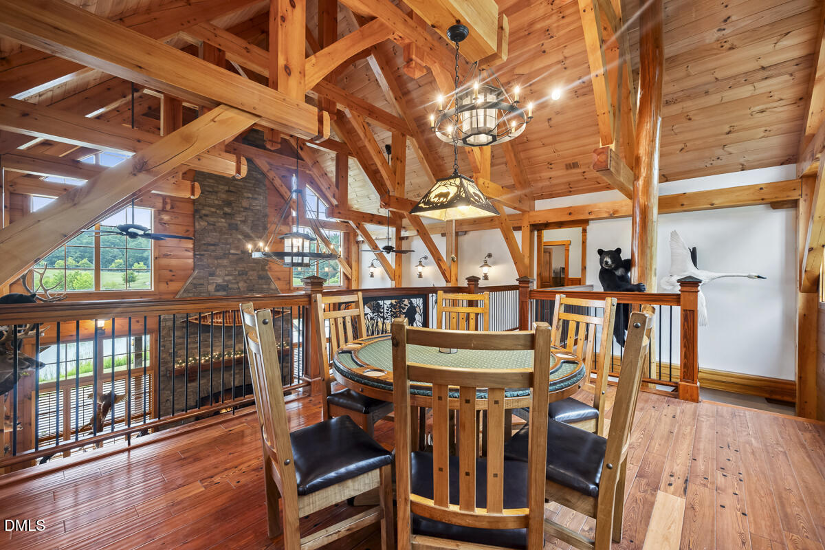 390 Line Creek Farm Road Yanceyville, NC 27379 - Photo 45 of 102 a view of a chairs and table in a patio