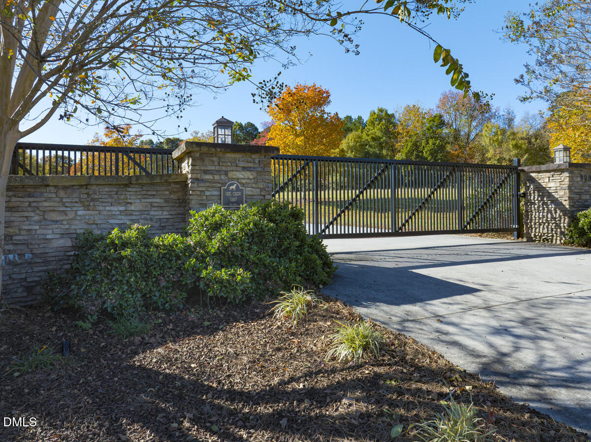 390 Line Creek Farm Road Yanceyville, NC 27379 - Photo 3 of 102 a view of backyard with wooden fence and potted plants