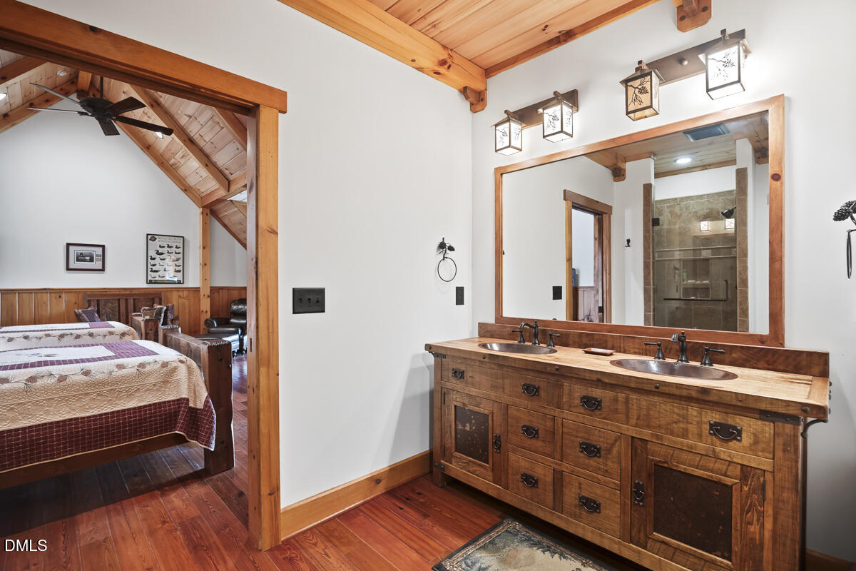 390 Line Creek Farm Road Yanceyville, NC 27379 - Photo 50 of 102 a bathroom with a sink and a mirror