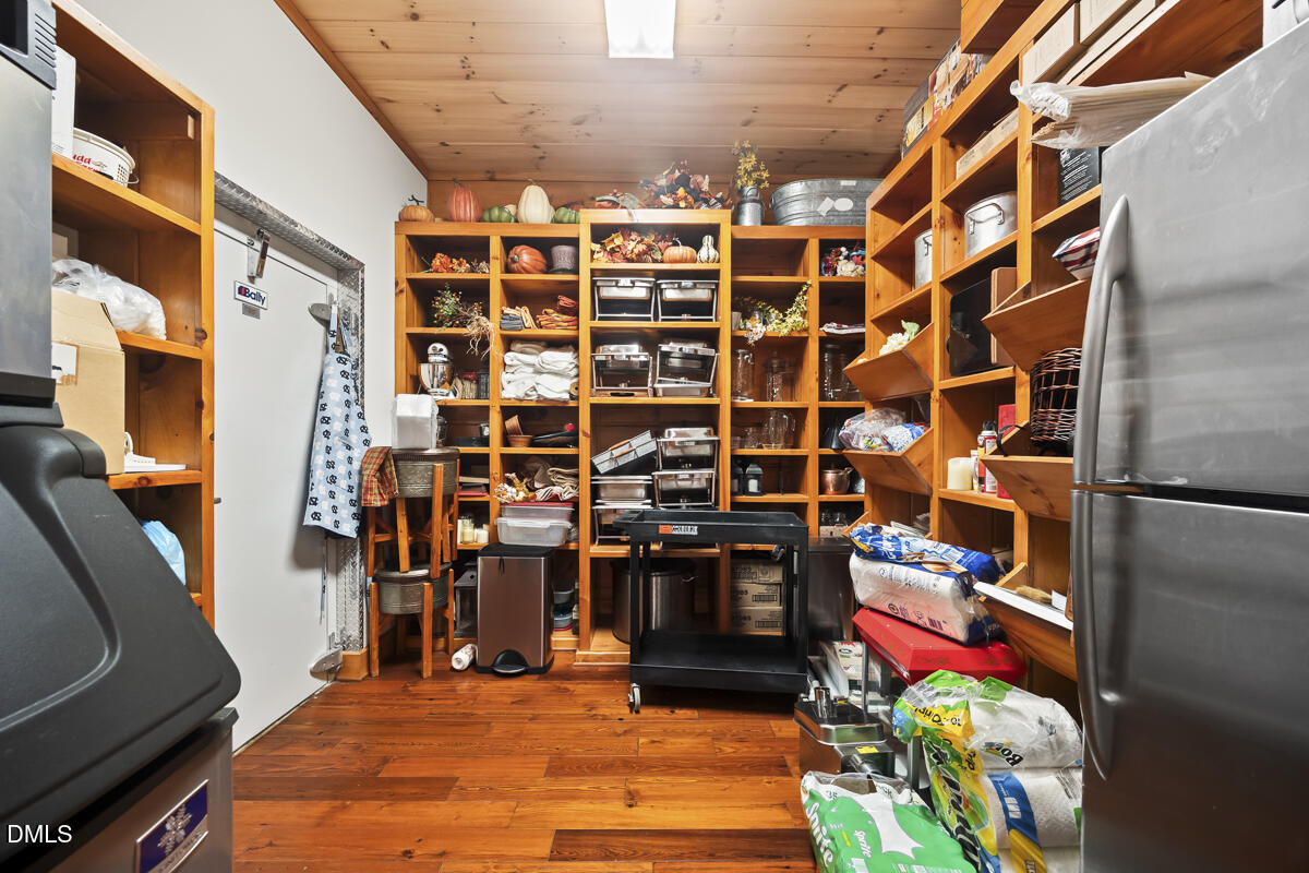 390 Line Creek Farm Road Yanceyville, NC 27379 - Photo 57 of 102 a view of walk in closet with clothes and shoes