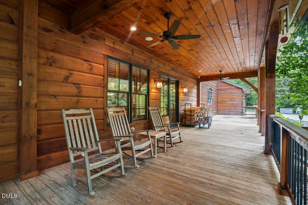 a view of a patio with table and chairs and potted plants