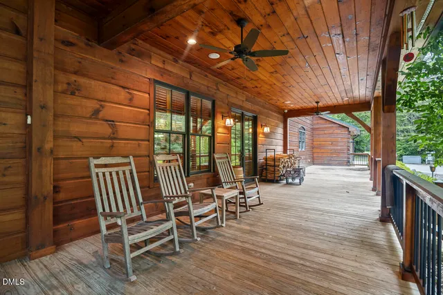 a view of a patio with table and chairs and potted plants