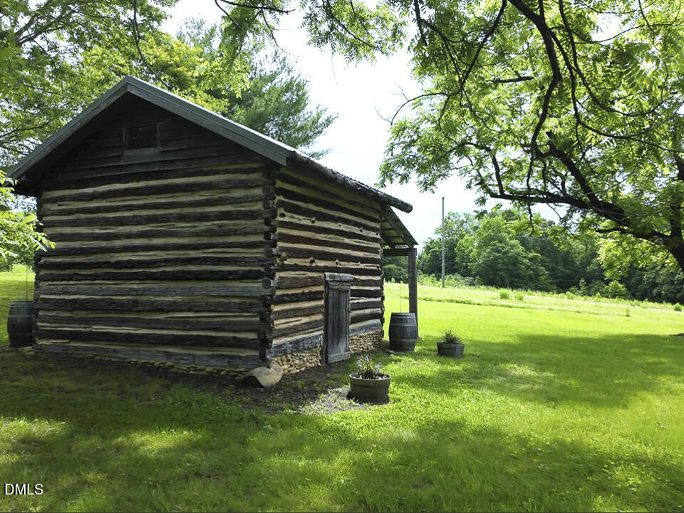 390 Line Creek Farm Road Yanceyville, NC 27379 - Photo 73 of 102 a view of a back yard of the house