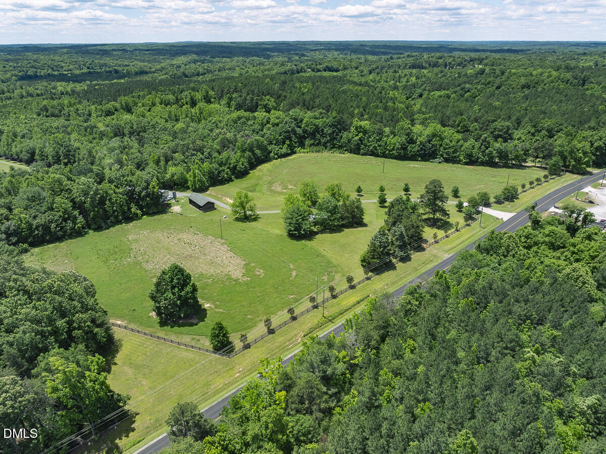 390 Line Creek Farm Road Yanceyville, NC 27379 - Photo 75 of 102 a view of a green field with lots of green space