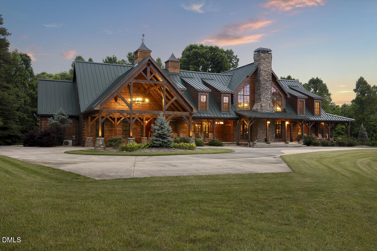 390 Line Creek Farm Road Yanceyville, NC 27379 - Photo 6 of 102 a front view of a house with a yard