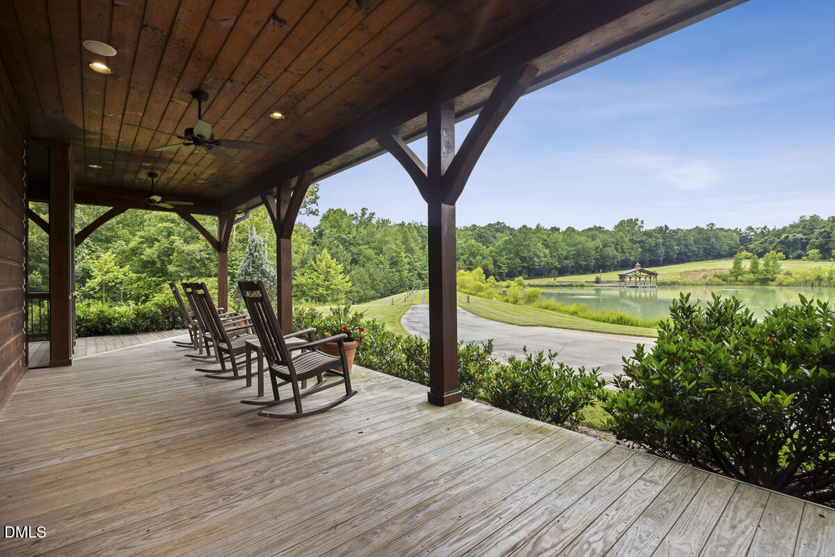390 Line Creek Farm Road Yanceyville, NC 27379 - Photo 7 of 102 a deck view with a garden and outdoor seating space