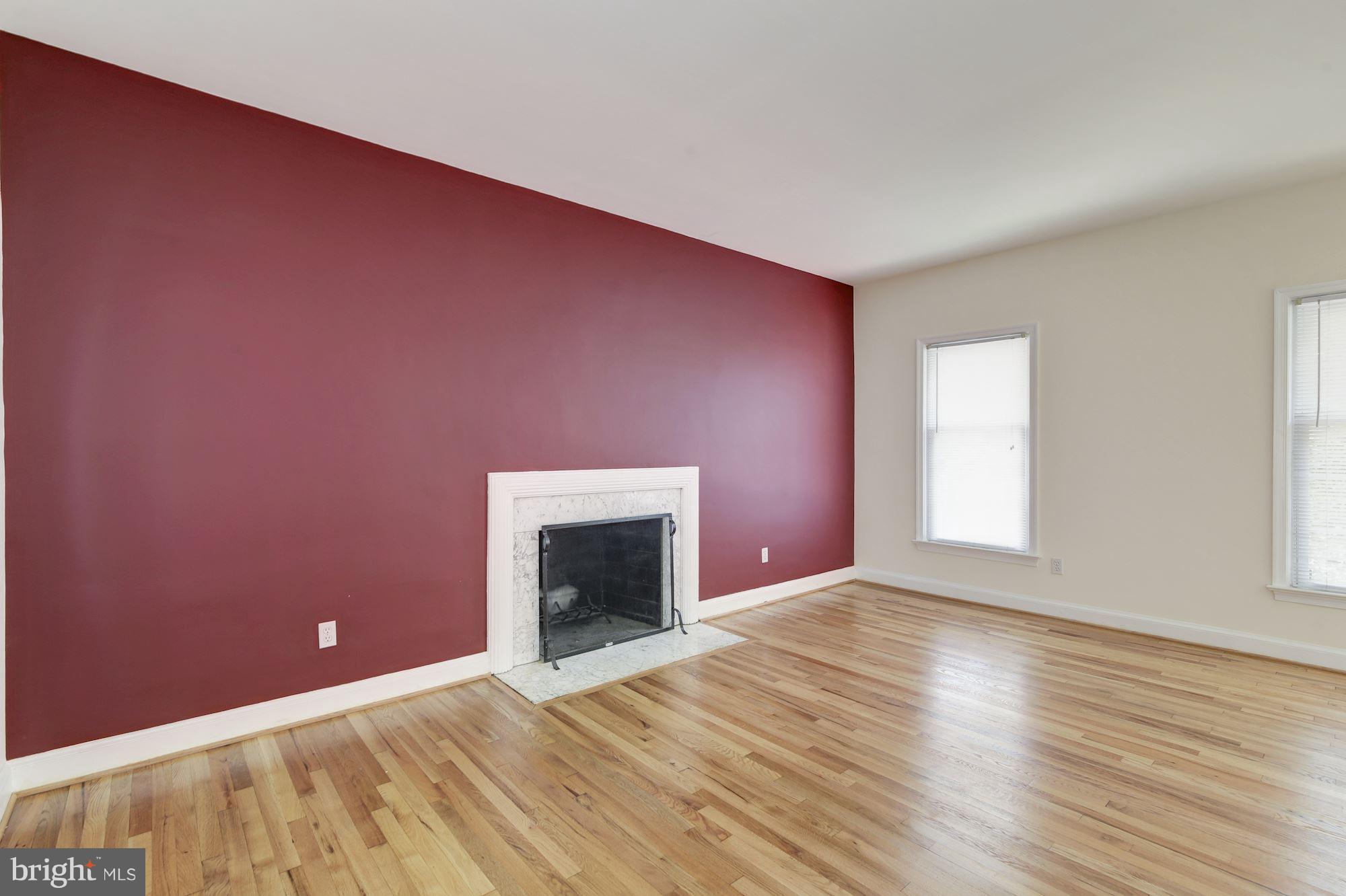 4200 River Road Northwest Washington, DC 20016 - Photo 13 of 30 a view of empty room with wooden floor and fireplace