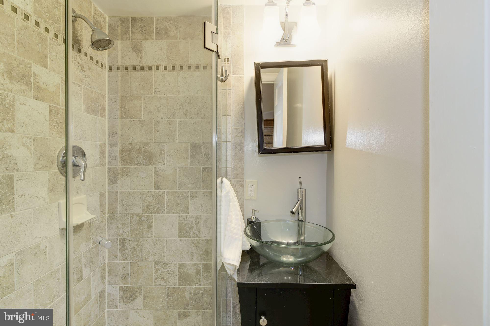 4200 River Road Northwest Washington, DC 20016 - Photo 14 of 30 a bathroom with a sink a toilet and shower