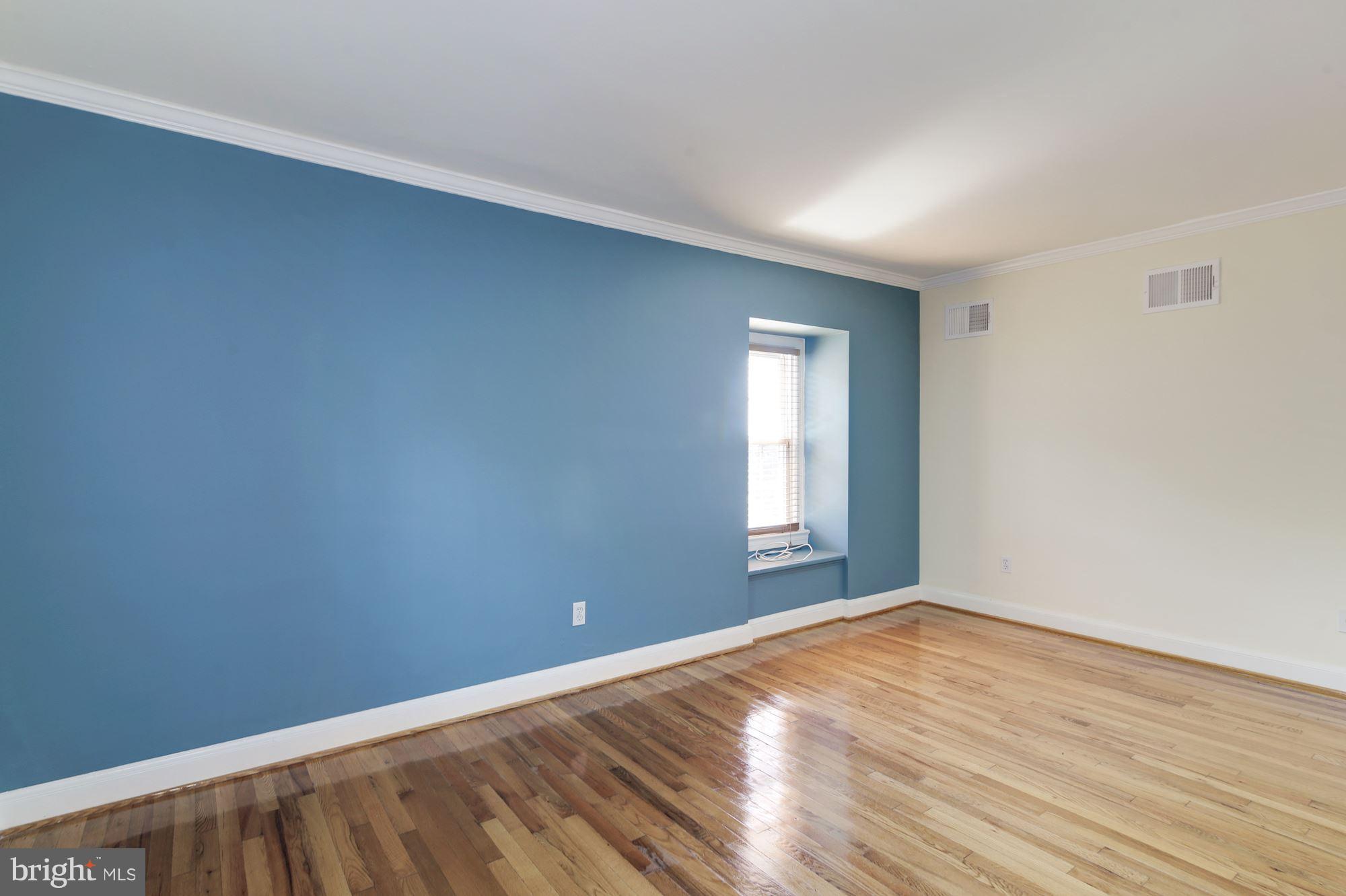 4200 River Road Northwest Washington, DC 20016 - Photo 15 of 30 an empty room with wooden floor and windows