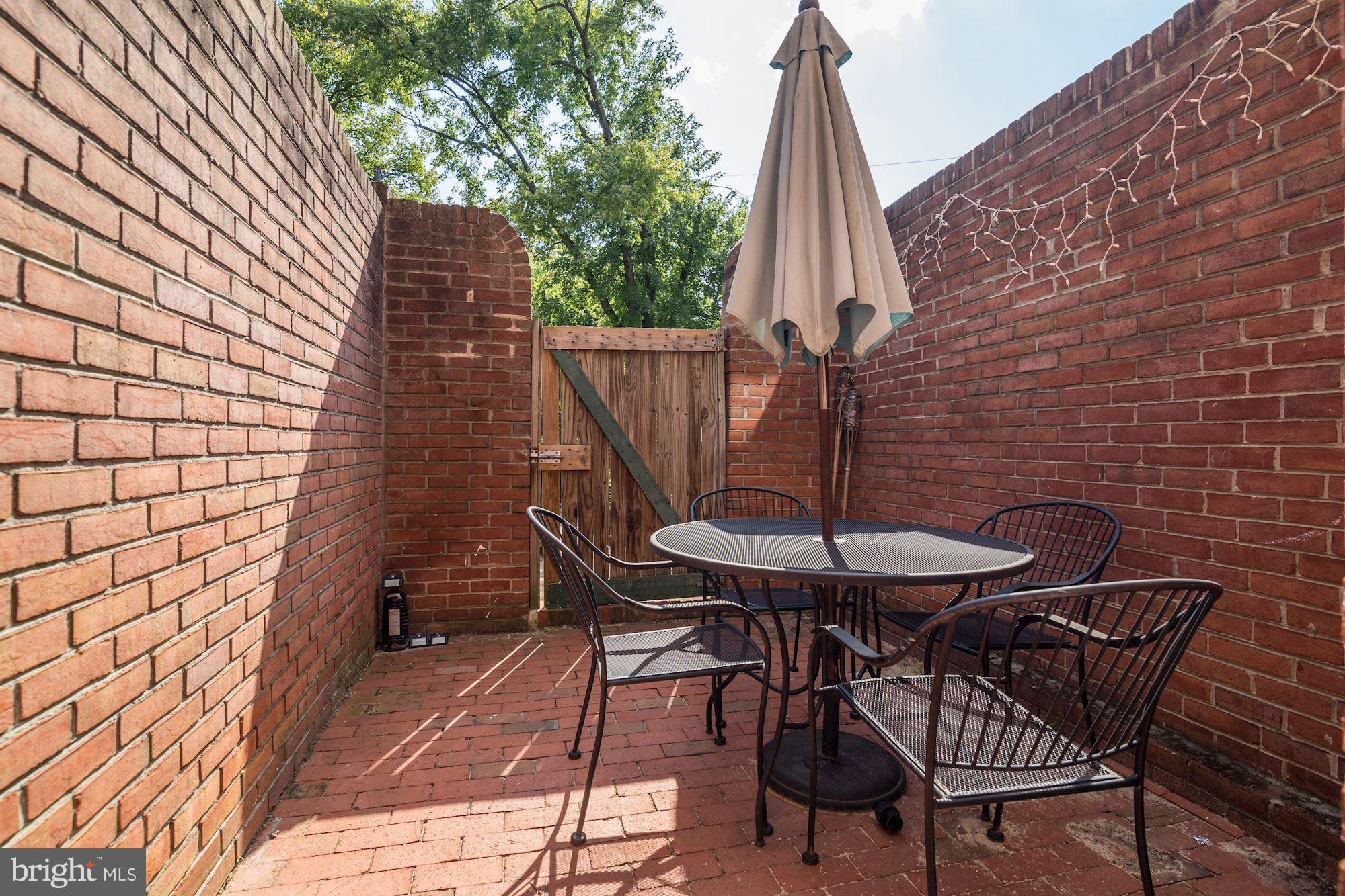 4200 River Road Northwest Washington, DC 20016 - Photo 22 of 30 a view of a backyard with furniture and a deck